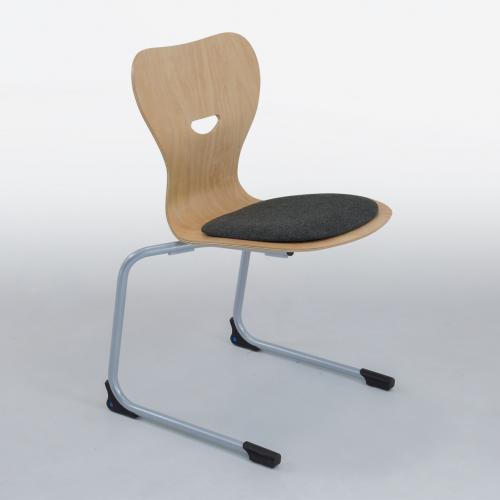 Freischwinger Schulstuhl mit Sperrholz Sitzschale Stapelbarer Freischwinger Schülerstuhl mit ergonomisch geformter Buchesperrholz- Sitzschale, mit Griffloch, Sitzhöhe 30 cm